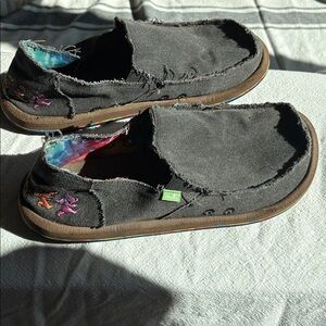 Sanuk Grateful Dead slip on shoes.